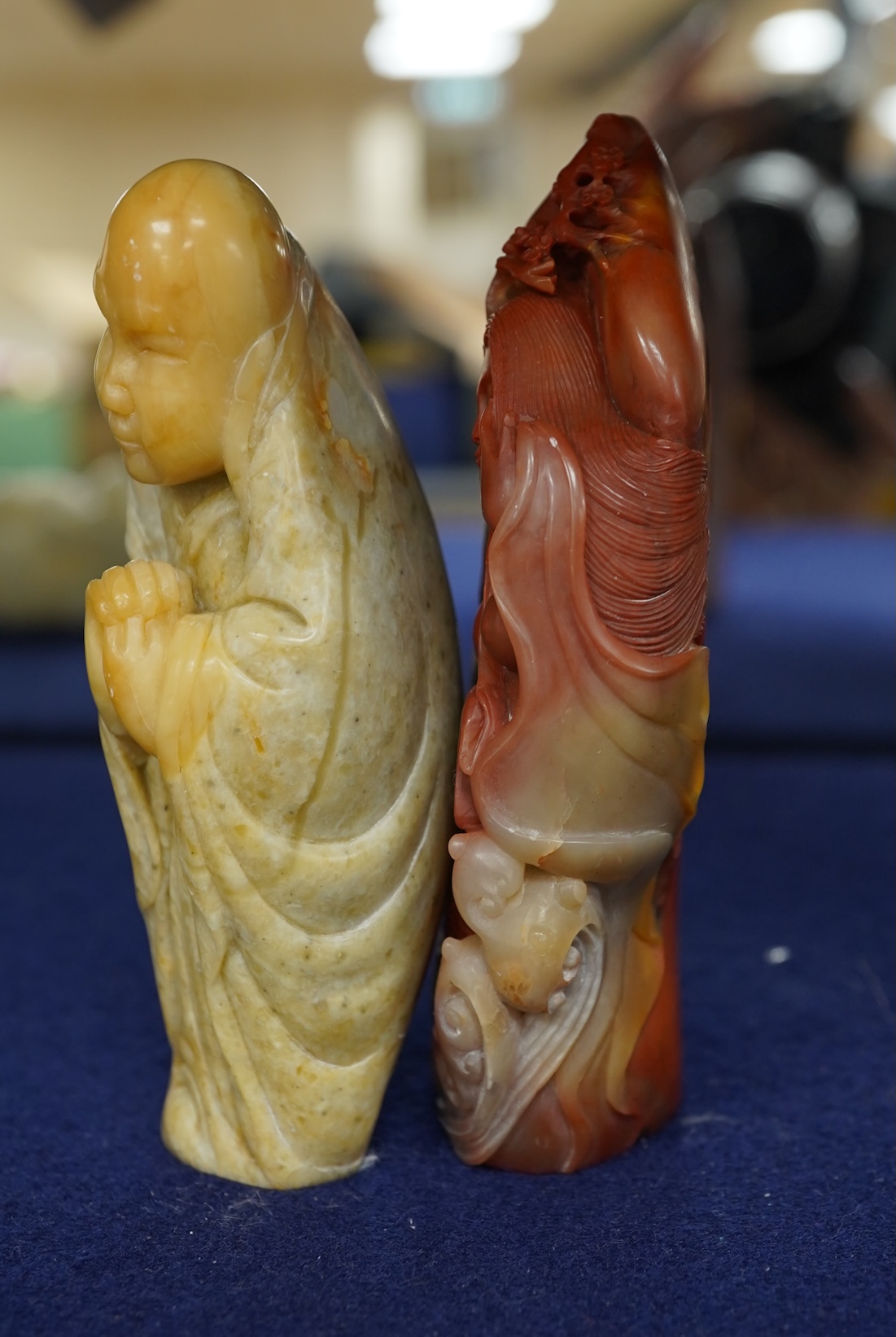 A Chinese white jade 'boys with jar' carving and three shoushan stone figures; luohan, girl with squirrel and mermaid (4), tallest 11cm